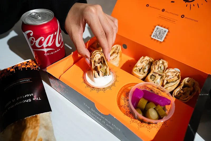 A shawarma wrap held up close