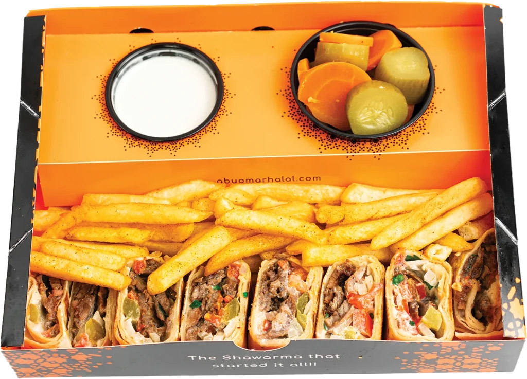 Pressed Arabi wrap of beef shawarma with tomatoes, parsley, onions, pickles and tahini sauce