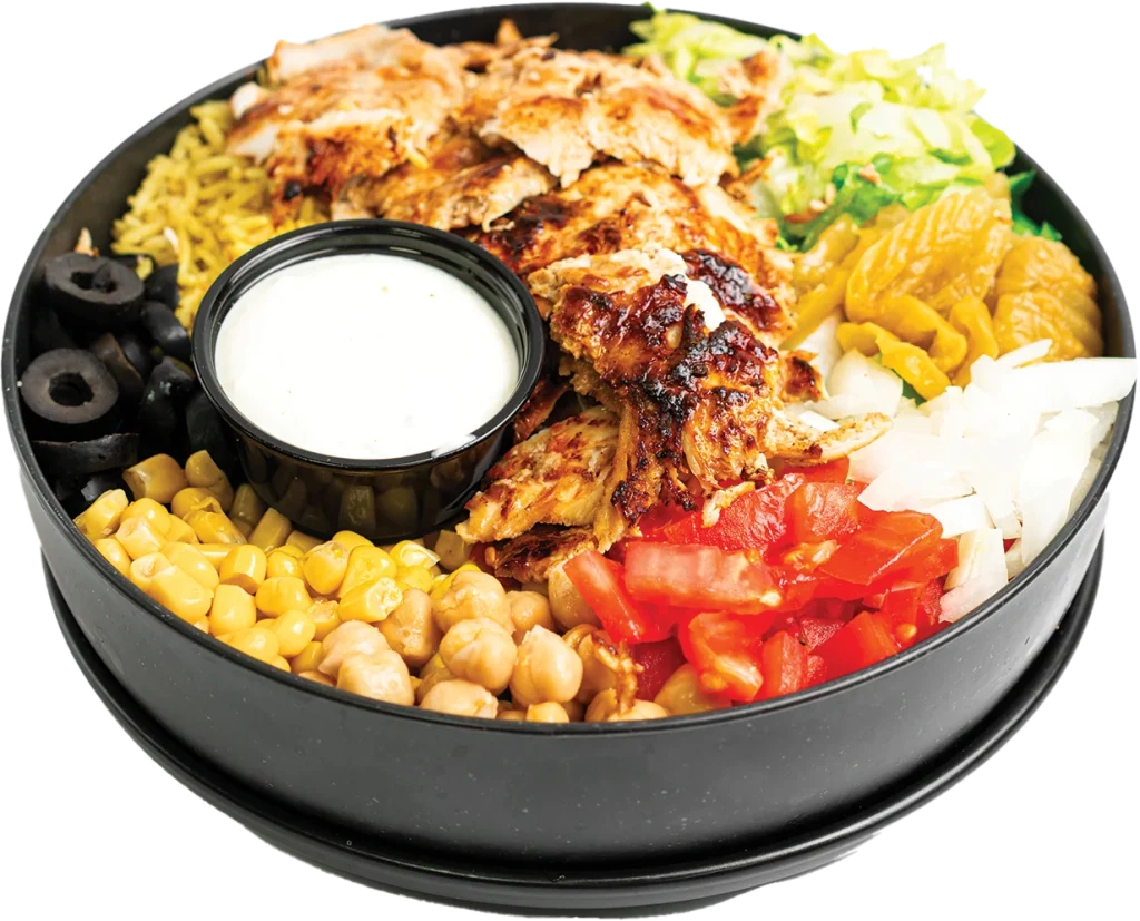 Shaved chicken shawarma over yellow rice, with a side salad