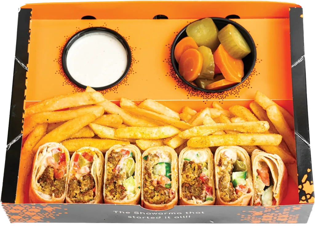Pressed Arabi wrap of falafel with hummus, tomatoes, pickles and tahini sauce