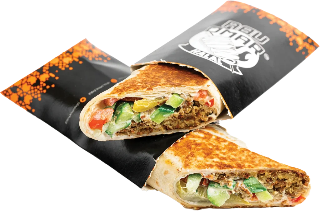 Falafel wrap with hummus, fresh tomatoes, pickles and tahini sauce