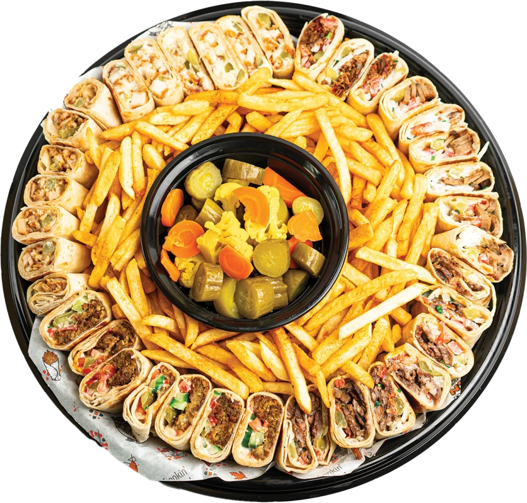 Family platter of four pressed shawarma wraps with seasoned fries, pickles and garlic sauce