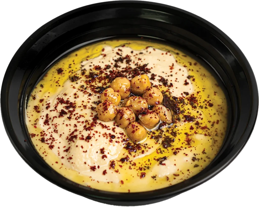 Creamy hummus dip of pureed chickpeas and tahini, served with warm pita bread
