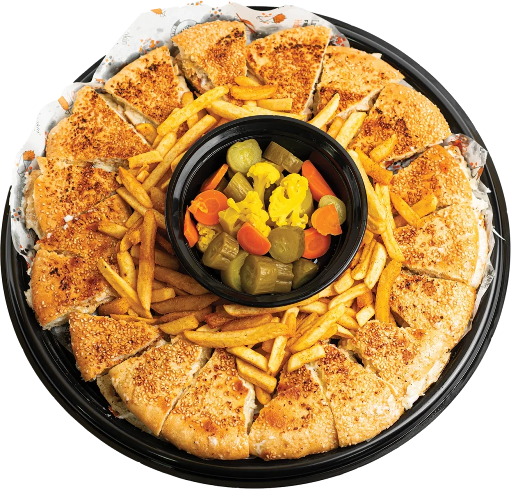 Family platter of four pressed Italian-style shawarma subs with a mound of seasoned fries